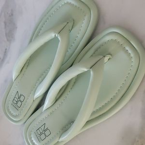 Mint green flip flops